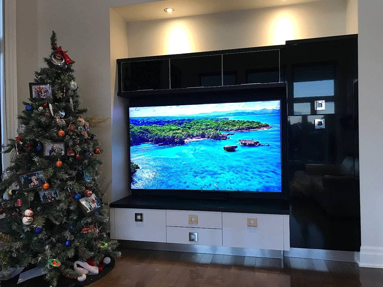 Samsung 75-inch TV installed in a custom wall cabinet in a Whitby house